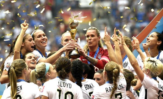 USA players celebrate their victory in the final football match between USA and Japan during the 2015 FIFA Women