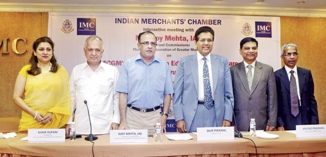 Ajoy Mehta (third from left) stands alongside others on the panel