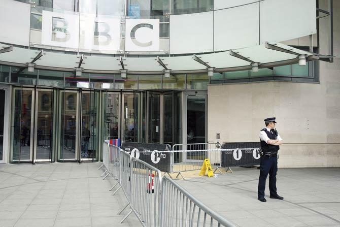 A policeman keeps watch outside BBC Broadcasting House in London. The BBC occupies a unique place because of its sheer longevity (90 years), quality and influence over the emerging and developed world. And because it is a public broadcaster Pic/Getty Images