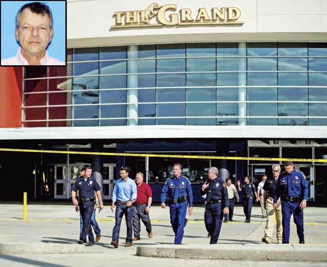 Louisiana Governor Bobby Jindal (second from left) outside the Grand 16 Theatre in Lafayette where John Rusell House shot three people on Thursday night. Pic/AP