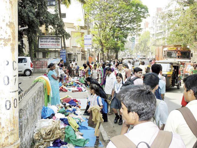 The street outside the school has been cornered by these ragpickers, who sell their wares from morning to sundown, forcing children to walk on the roads amidst traffic