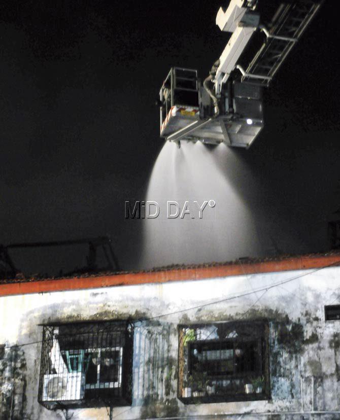 The fire brigade try to douse the flames at Dagadi Chawl in Byculla. Pic/Satyajit Desai