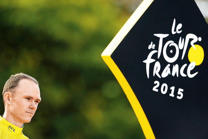 Chris Froome atop the podium after winning his second Tour De France title in Paris on Sunday. pics/afp