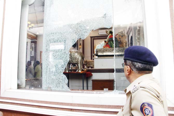 The temple had no security guard and the glass window did not have a metal grill. The thief entered and exited from this window, which he smashed with the help of a brick