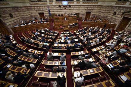 Greek's parliament approves debt deal, reforms to avert Grexit
