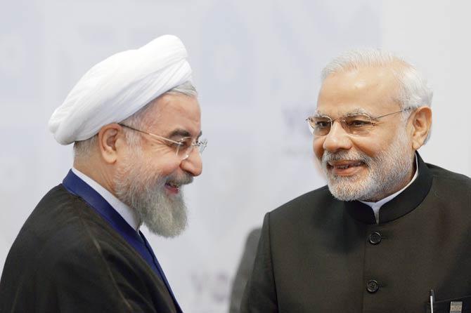 During his meeting with Prime Minister Modi at the sidelines of the Ufa summit, President Hassan Rouhani of Iran called on India to invest in infrastructure projects worth $8 billion. Pic/AFP