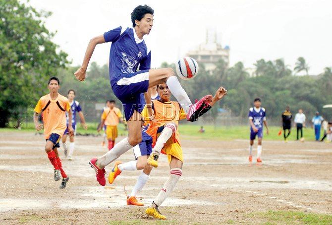 The Cathedral and John Connon’s  Kavan Modi (in blue) controls the ball during a MSSA U-16 Div-II match against Colaba Municipal at Azad Maidan yesterday. pic/shadab khan 