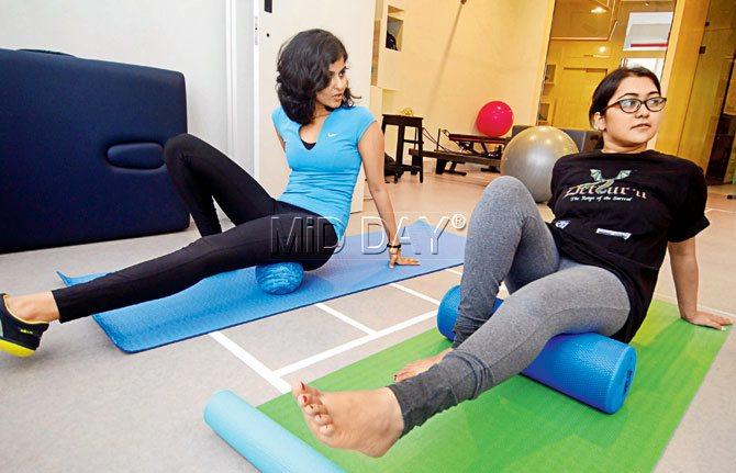 Krushmi Chheda helps us with a quick warm-up using the foam roller at CORE. PICS/Sameer Markande