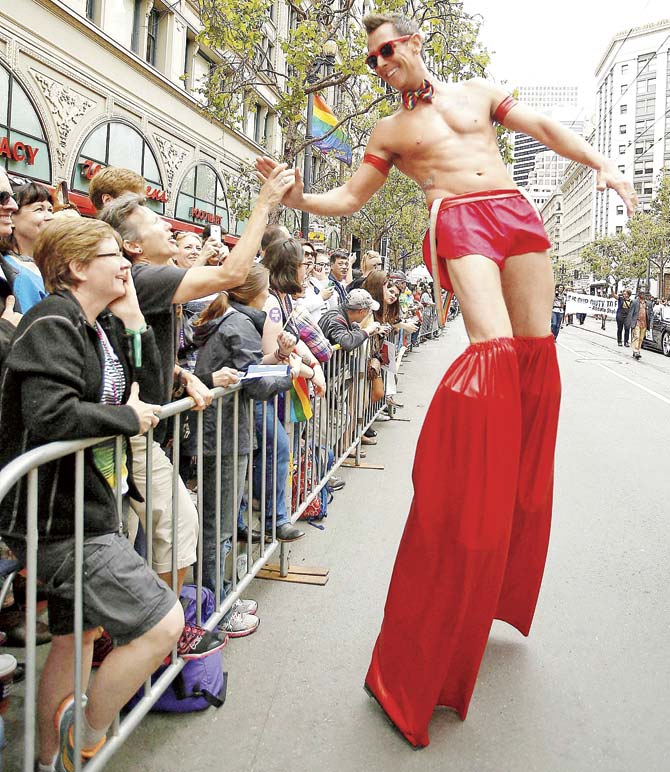 A performer greets spectators during the 45th annual San Francisco Gay Pride parade as there was a large turnout following the landmark Supreme Court ruling that said gay couples can marry anywhere in the US. Pic/AP