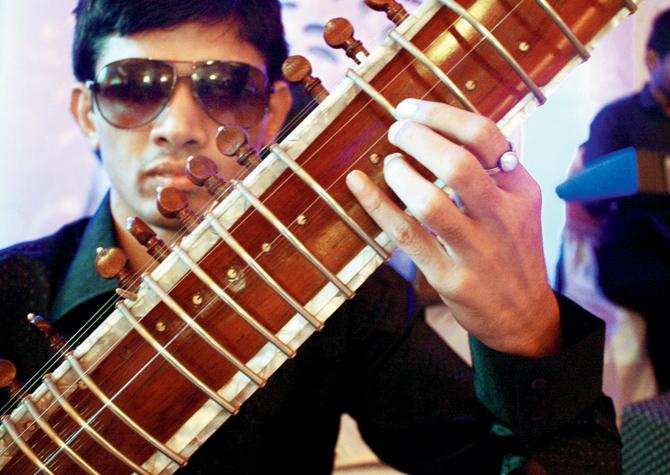 A photograph of Mahesh Umrannia, a visually impaired Sitar player by his fellow participant Harsh Vyas