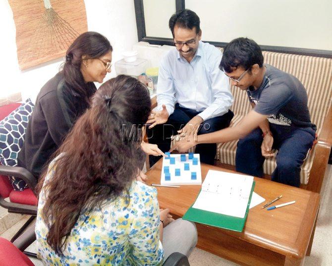 Mandal and his team unwind over a board game