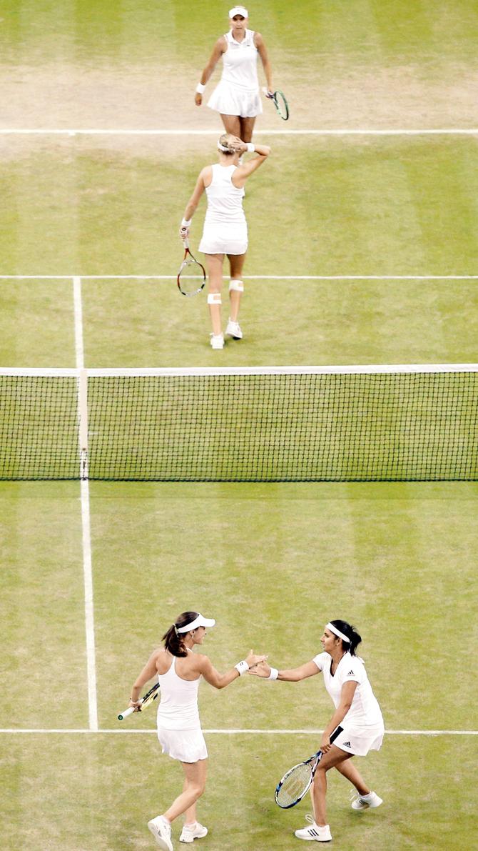 Mirza-Hingis celebrate a break of serve against Elena Vesnina and Ekaterina Makarova in Saturday’s ladies doubles final at Wimbledon 