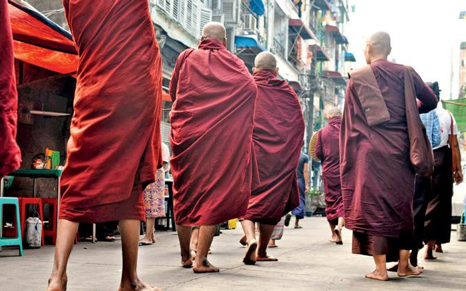 Monks make rounds for alms, Myanmar