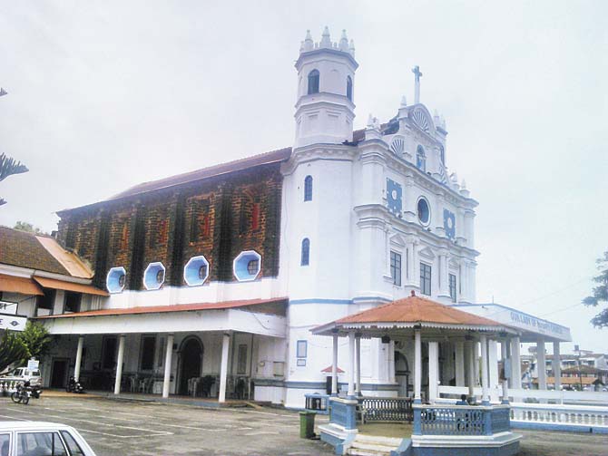 The fortress-like church of Our Lady of the Rosary in Navelim, in the south of Margao (l)