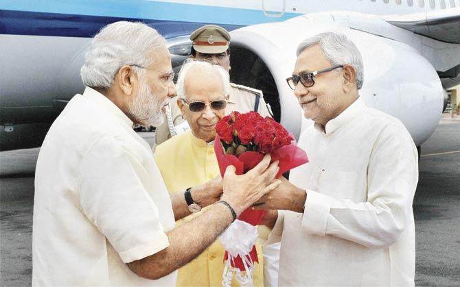 Narendra Modi with Bihar Chief Minister Nitish Kumar at Patna airport. Pic/PTI
