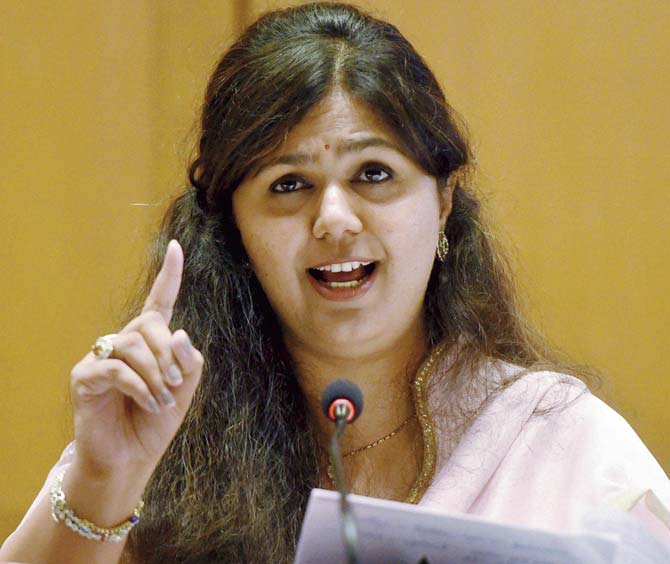 With hundreds of her supporters in tow, Munde challenged the might of her detractors both within and outside the party. She asked CM Devendra Fadnavis to initiate a probe into the allegations, saying she would quit if she was found guilty. Pic/PTI