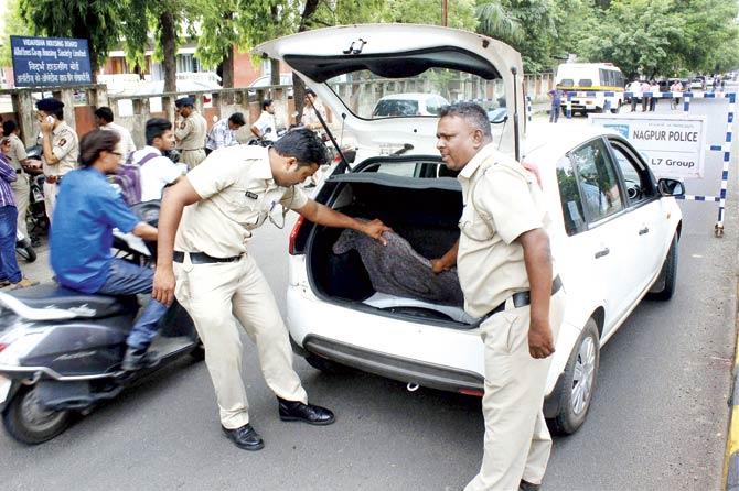 A car being checked at a nakabandi in Nagpur yesterday. Pics/PTI