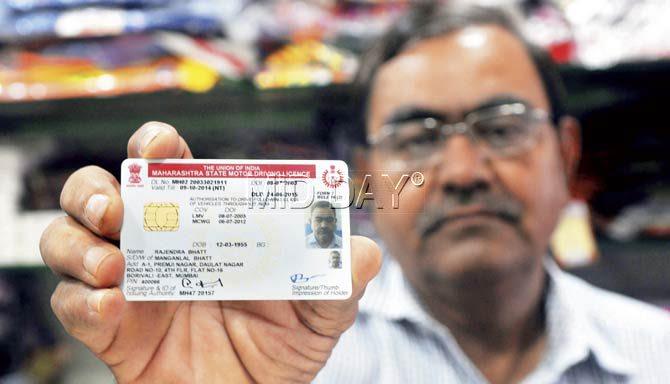 Rajendra Bhatt shows his ‘renewed’ licence