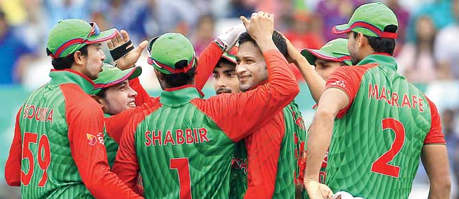 Shakib Al Hasan (centre) celebrates with teammates the wicket of South Africa skipper Hashim Amla in Chittagong on Wednesday