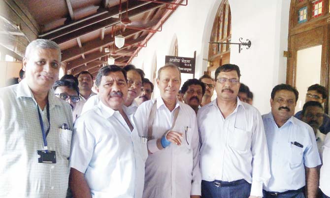 (Right to left) Sainath Rajadhyaksha, general secretary, Brihanmumbai Municipal Engineers Union, Mahabal Shetty, general secretary, Municipal Mazdoor Union, and Sukhdev Kashid, secretary, Municipal Engineers Association, with other engineers outside the commissioner’s office yesterday