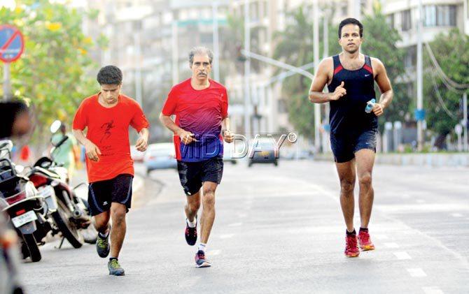 Star distance runner from the 1980s, Savio D’Souza (centre) is one of South Mumbai’s most coveted coaches, mentoring students at Nariman Point, not very far from University Ground where he trained for free. Pic/ Bipin Kokate
