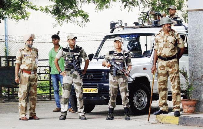 Security personnel stand guard outside the Nagpur airport