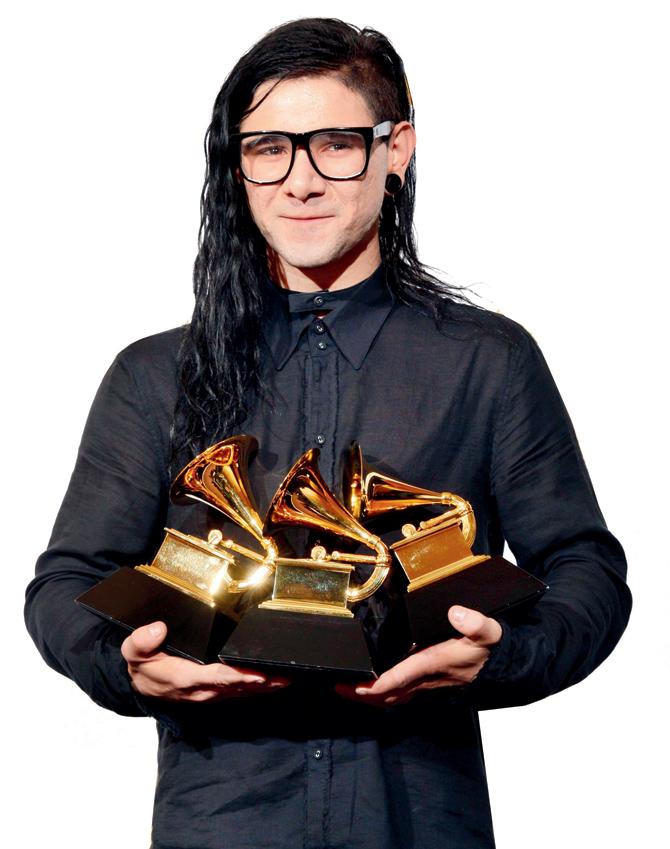 Skrillex poses with his trophies at the 55th Grammy Awards in California, February 2013. pic/afp