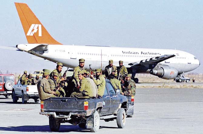 Taliban commandos head towards the hijacked Indian Airlines plane at Kandahar airport in Afghanistan in December, 1999. Pic/AFP
