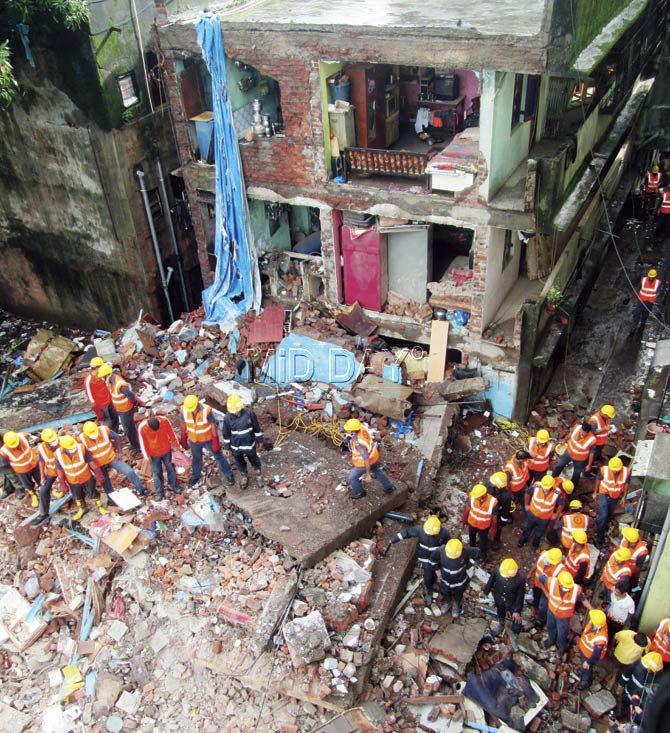 Rescuers scan the rubble for survivors and dead. Pics/Sameer Markande