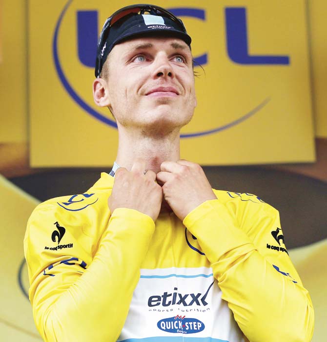 Germany’s Tony Martin celebrates his yellow jersey after stage four of the Tour de France, between Seraing and Cambrai yesterday. Pic/Getty Images