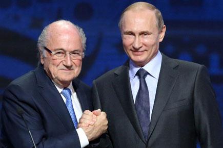 Putin says 'clean' FIFA boss Sepp Blatter deserves Nobel Prize