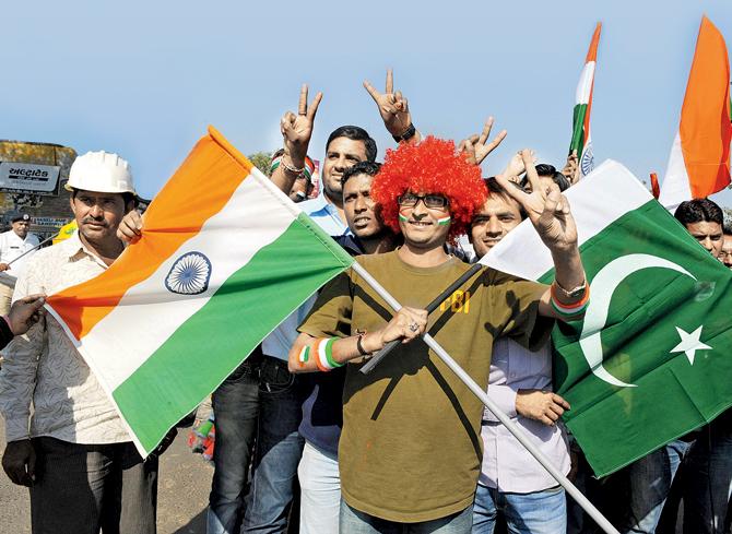 An Indian fan poses with flags of India and Pakistan outside the Sardar Patel Stadium in Motera near Ahmedabad before a Twenty20 match on December 28, 2012. pic/aFP
