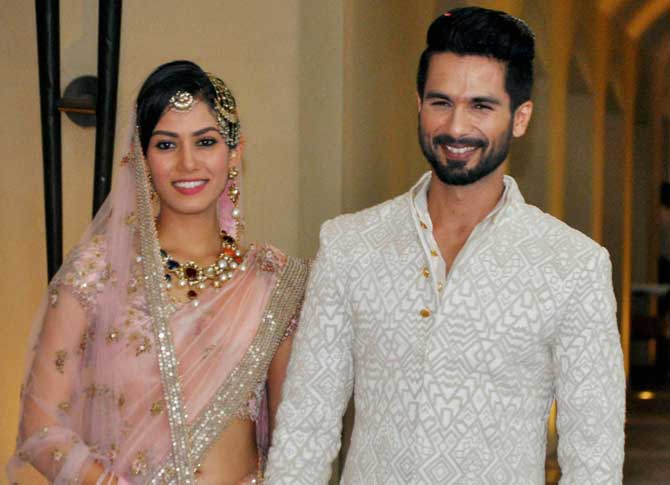 Actor Shahid Kapoor and his wife Mira Rajput pose for photographers after their wedding ceremony in Gurgaon, on Tuesday. Pic/PTI