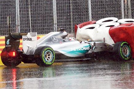 Lewis Hamilton fastest in practice, then crashes in the rain
