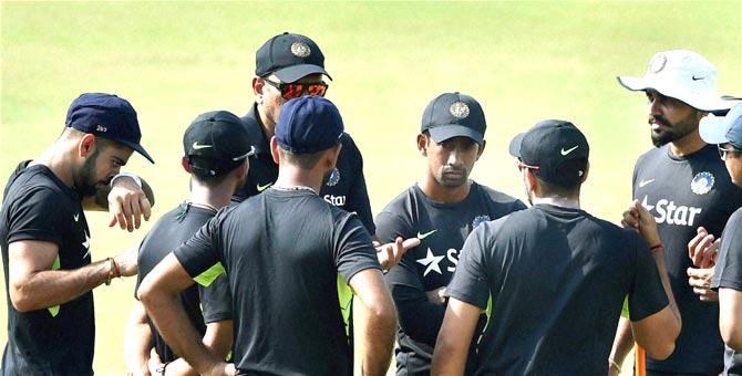 Indian Cricketers talks with team director Ravi Shastri during their training session at Eden Garden in Kolkata ahead of their BAngladesh tour. Pic/PTI