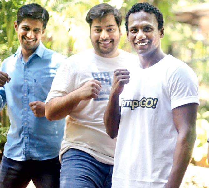 National boxer Mrunal Bhosale (right) with his TempoGo colleagues in Goa
