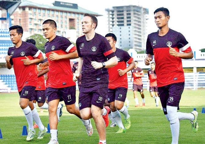 Sunil Chhetri (centre) attends a practice session with his India teammates at Bangalore