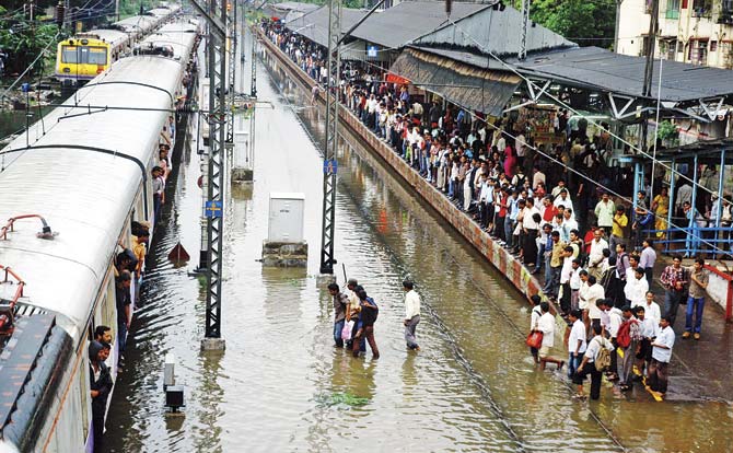The lowering of the tracks by 1 cm at Currey Road means such scenes will be all too common this monsoon. Files pic