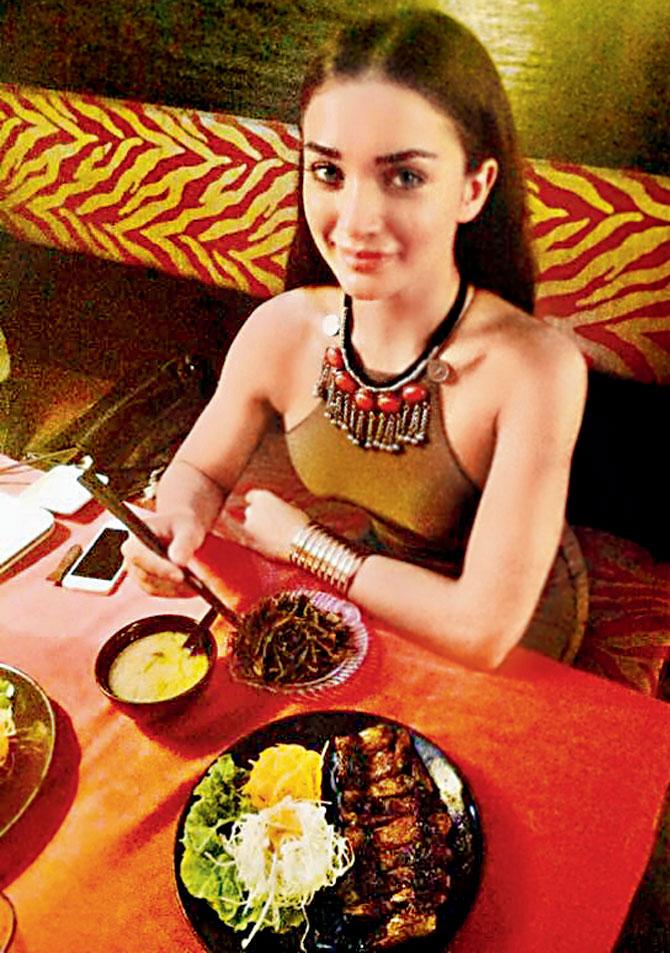 Amy Jackson tucks into grilled chicken and seaweed salad 