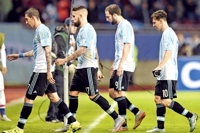 Angel Di Maria (extreme left), Nicolas Otamendi, Gonzalo Higuain and Lionel Messi (extreme right) walk off after Argentina