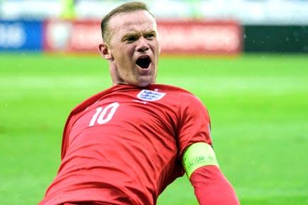 Rooney sees off Slovenia to close on record
