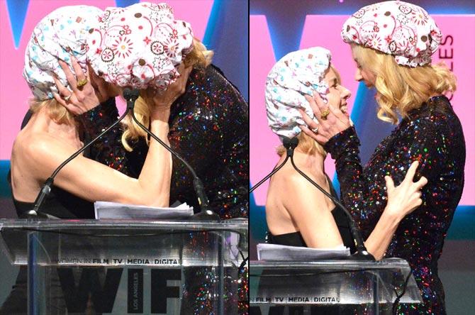 Naomi Watts and Nicole Kidman share a kiss onstage during the Women In Film 2015 Crystal + Lucy Awards in Century City, California. Pics/AFP