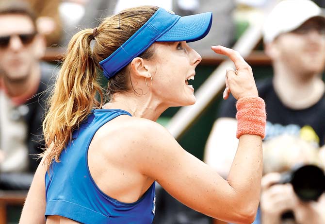 Cornet loses her cool: Alize Cornet argues with the referee during her match against Elina Svitolina in Paris yesterday. Pic/AFP