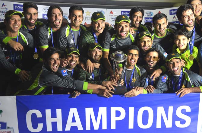 Pakistani cricketers pose with the trophy at the end of the third and final one day international match between Pakistan and Zimbabwe at the Gaddafi Cricket Stadium in Lahore. Pic/AFP