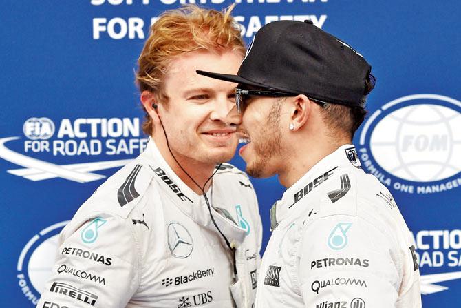 Lewis Hamilton (right) along with Mercedes teammate Nico Rosberg 