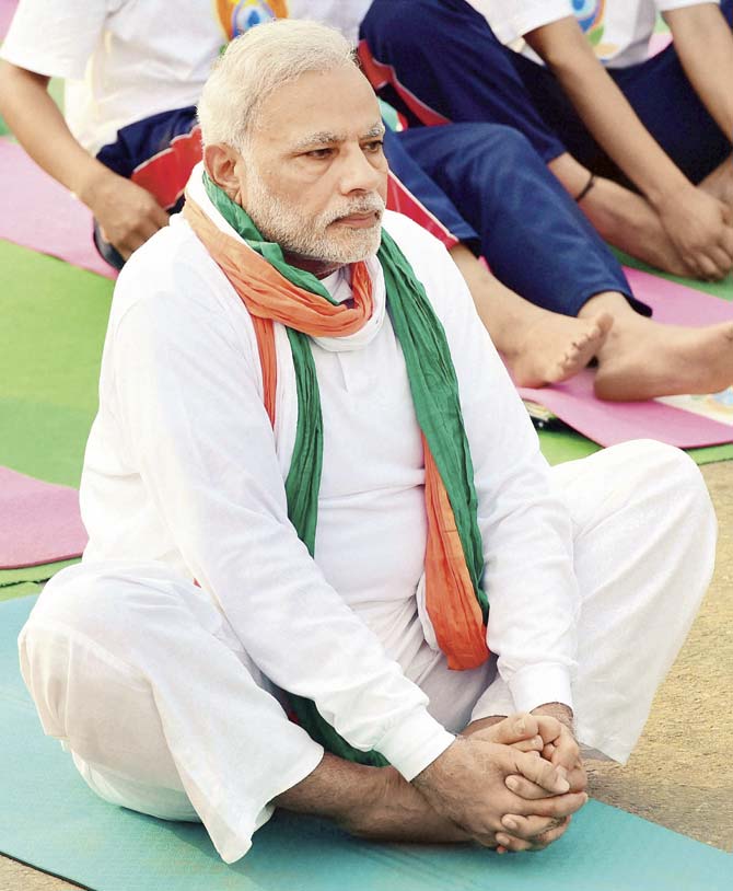 Prime Minister Narendra Modi performs an asana during a mass yoga session on International Yoga Day 2015 at Rajpath in New Delhi yesterday. Pic/PTI