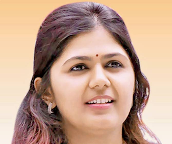 Pankaja Munde is accused of clearing purchases worth R206 crore without inviting e-tenders