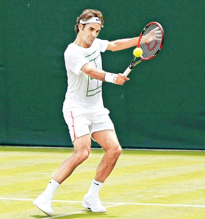 Roger Federer plays a shot during a practice session ahead at the All England Tennis Club in Wimbledon on Thursday. Pic/AFP