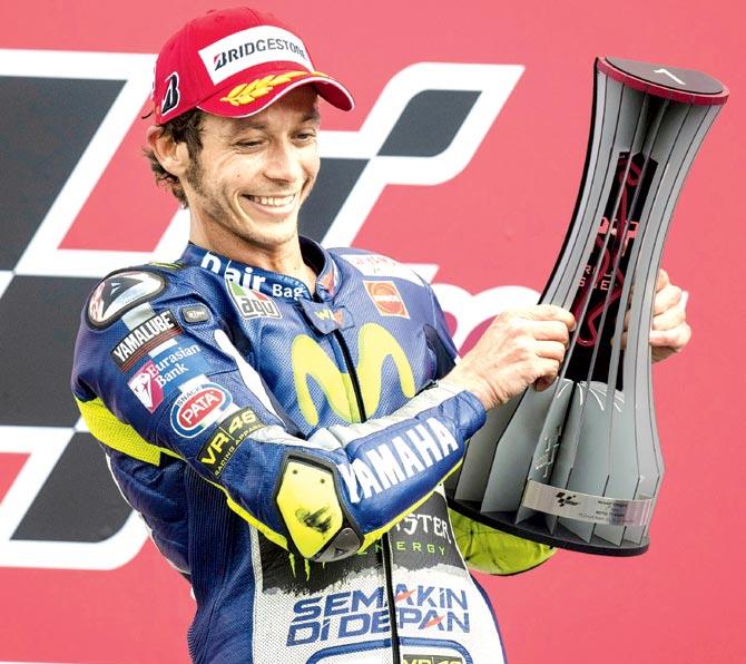 Valentino Rossi celebrates the victory on the podium in Assen, Netherlands. Pic/Getty Images