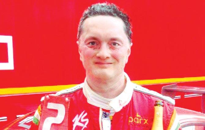 Industrialist and sportsman Gautam Singhania with his rewards in the Coppa Shell category of the Hungarian leg of the Ferrari Challenge Europe Championship 2015 at Budapest